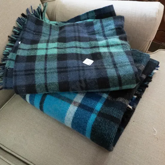 2 checked travel rugs