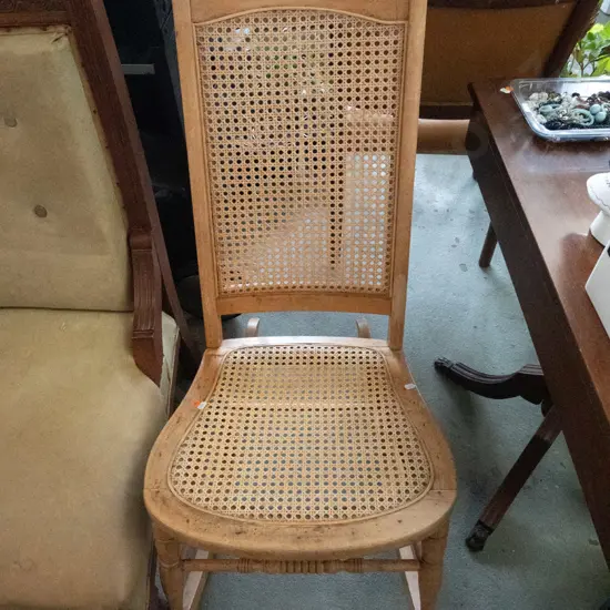 vintage beech rocking chair with woven cane back and seat - some looseness to back