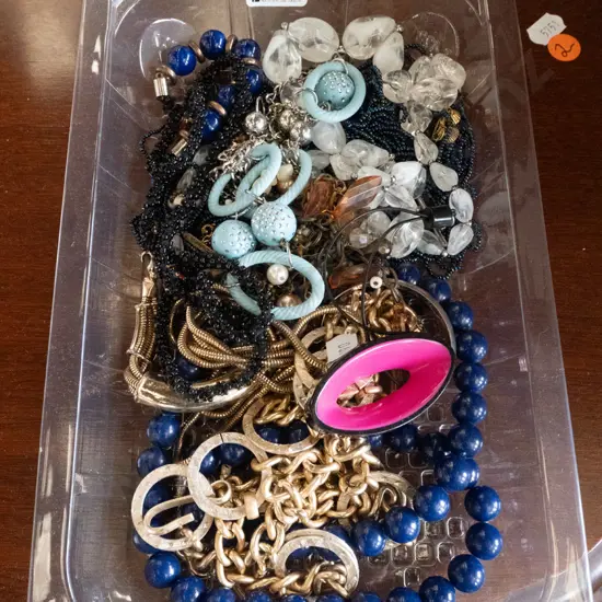 plastic tray of costume jewellery