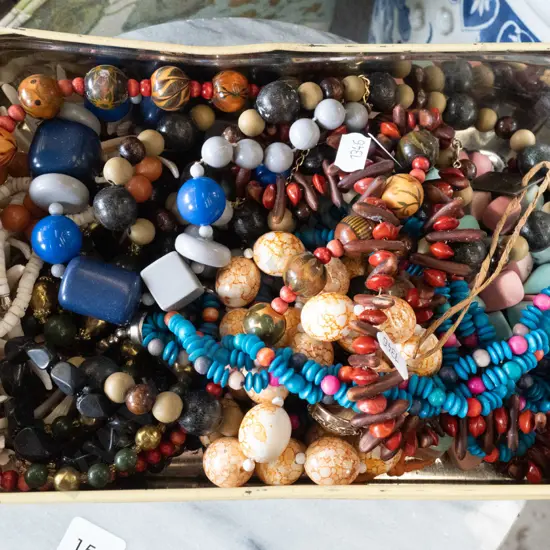 tin of costume jewellery