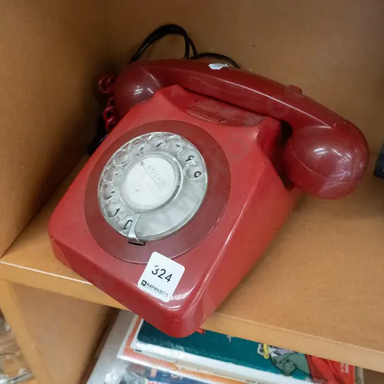 red plastic dial phone