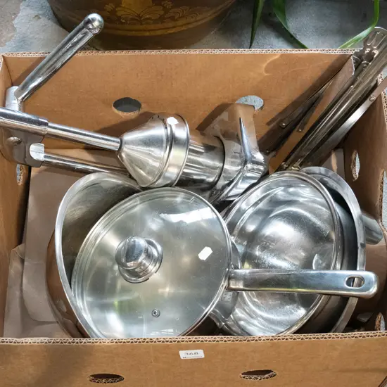 box; stainless steel bowls, citrus squeezer, saucepan, music stand