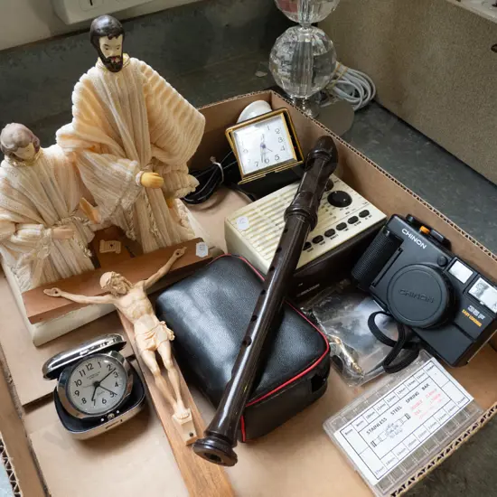 box; recorder, 35mm camera, crucifix, religious figurines etc
