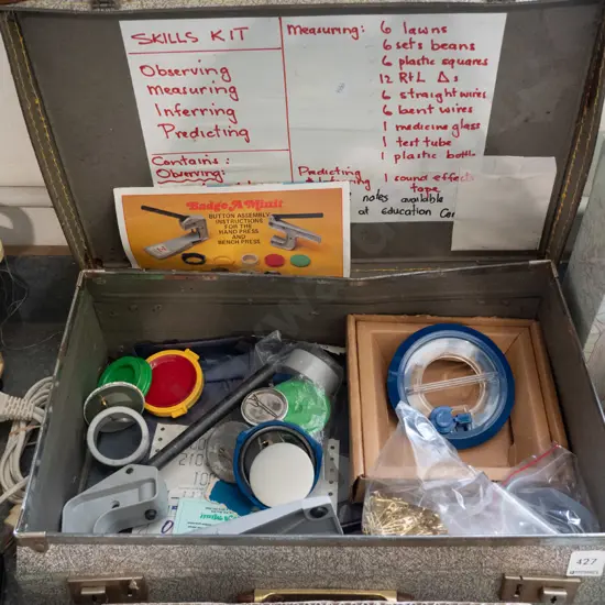 vintage suitcase with badge making kit