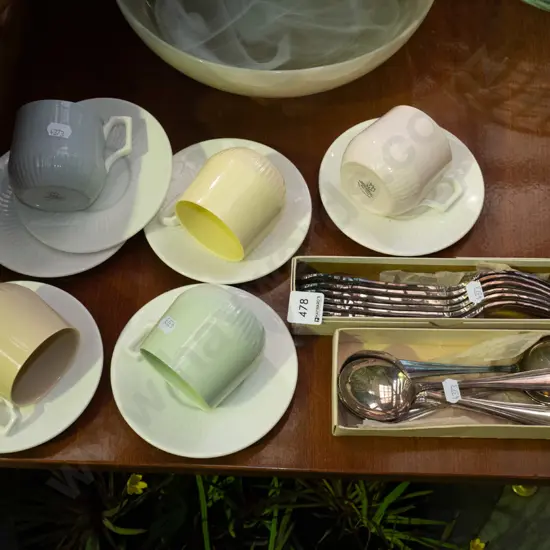 bone china cups and saucers, plated spoons, forks