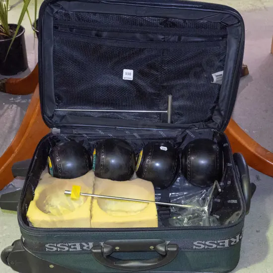 suitcase and lawn bowls