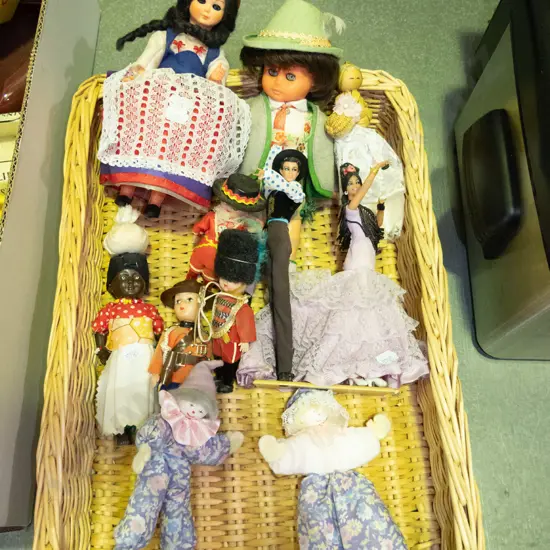 cane tray and various dolls of the world