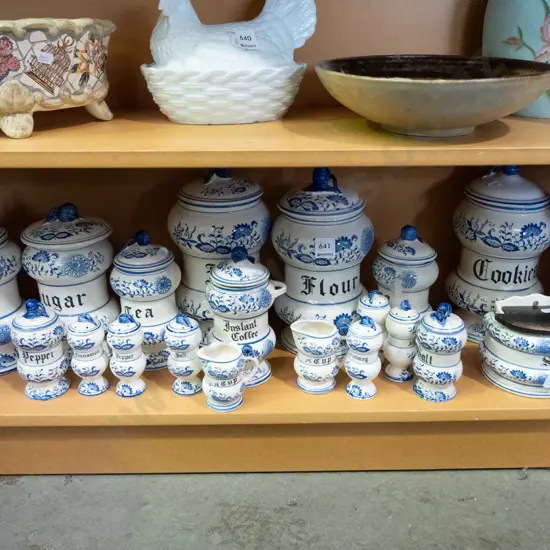 large assortment of blue and white kitchen canisters, salt & pepper shakers, jugs etc.