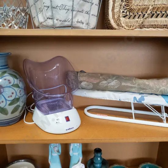shelf; ironing board, face steamer, pottery vase 