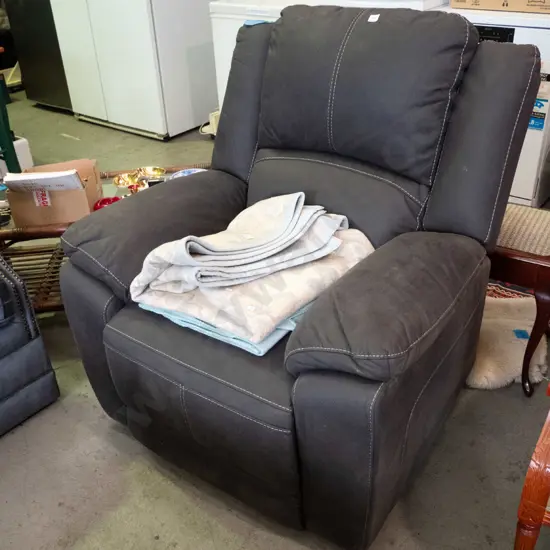 black upholstered electric armchair