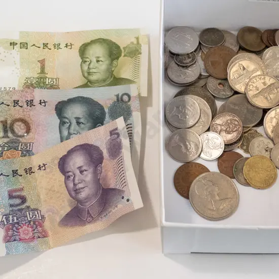 box of coins and notes