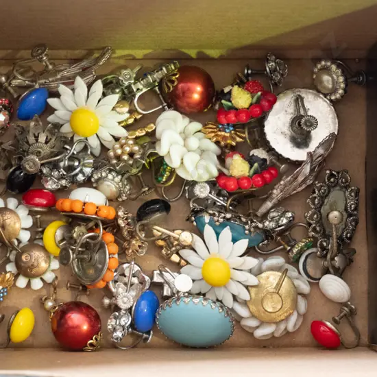 box of various screw earrings
