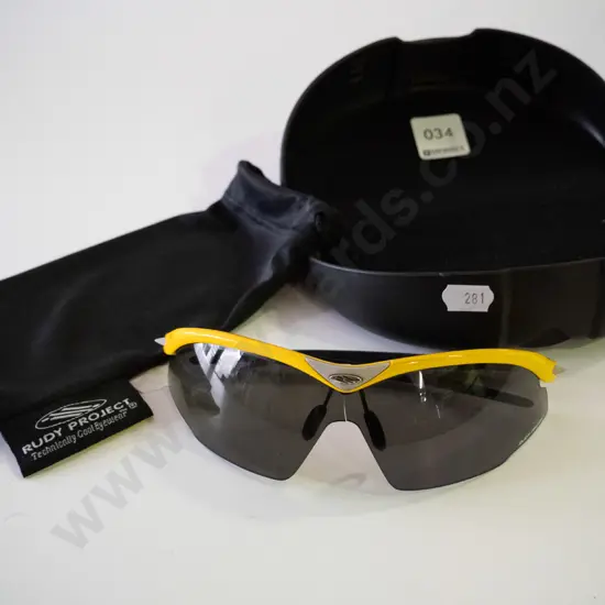 pair of cased Rudy Project sunglasses