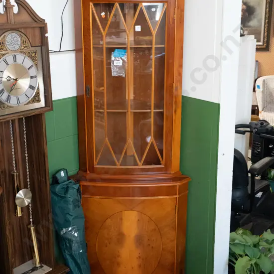 reproduction yew corner cupboard with astragal glazed top door, solid lower cupboard, 2 shelves in top, 1 in bottom