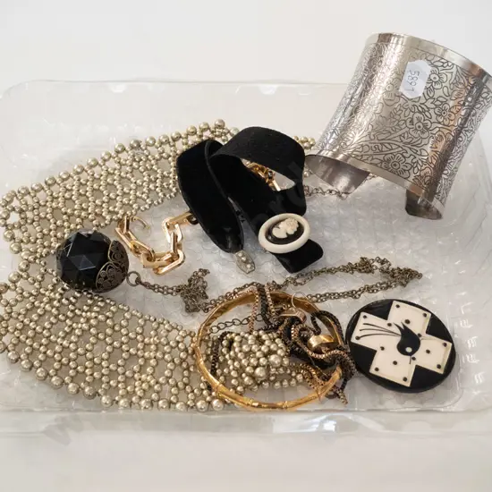 tray; necklace, bracelet, badges etc