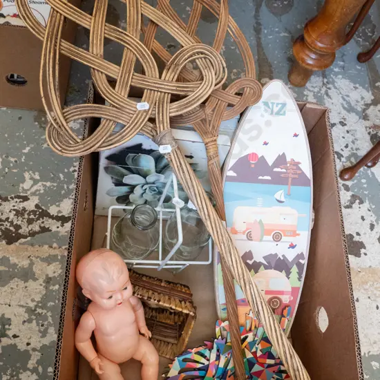 box; ornamental surfboard, dolls, carpet beaters etc