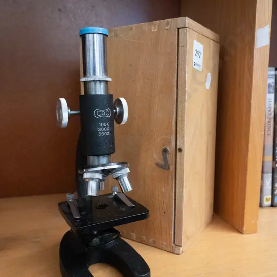 small microscope with wooden case