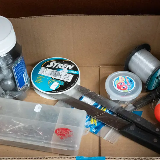 box; fishing lines, sinkers, hooks, knives etc