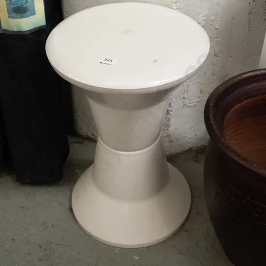 white plastic Caroma stool