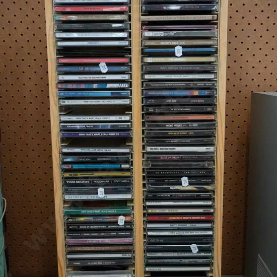 wooden CD tower and CDs H-620