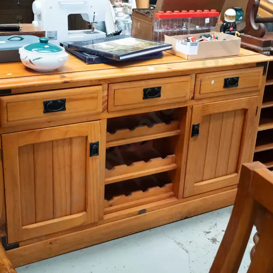 pine sideboard, 2 doors, 3 drawers and wine racks H-850 W-1465 D-450