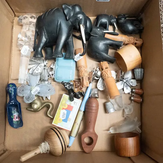 box; elephants, bottle stoppers, spinning tops