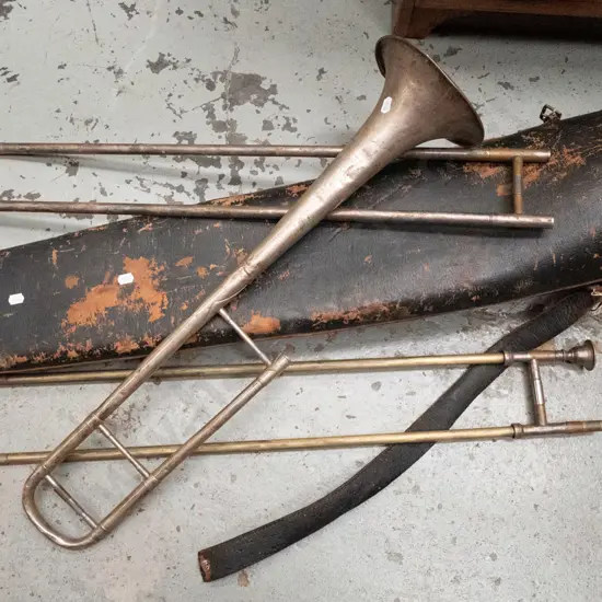 vintage trombone in battered carry case