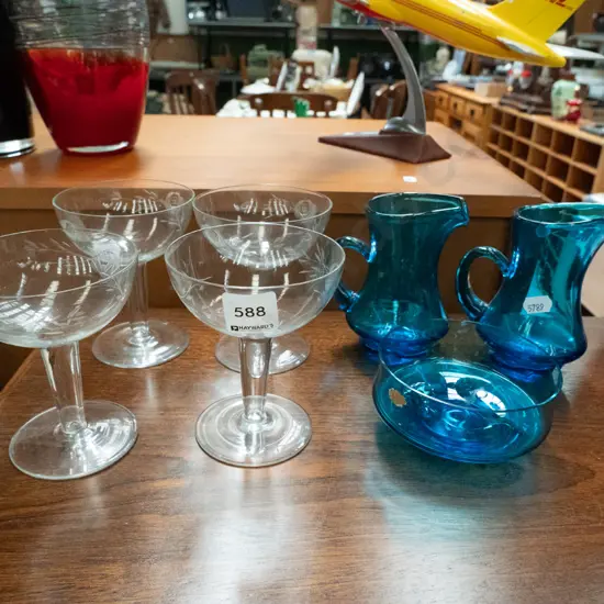 blue glass bowl, jugs, 4x hollow stemmed champagne glasses