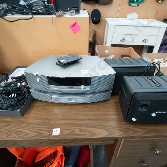 Bose stereo system with 2 wall mounted speakers and remotes- remotes in office