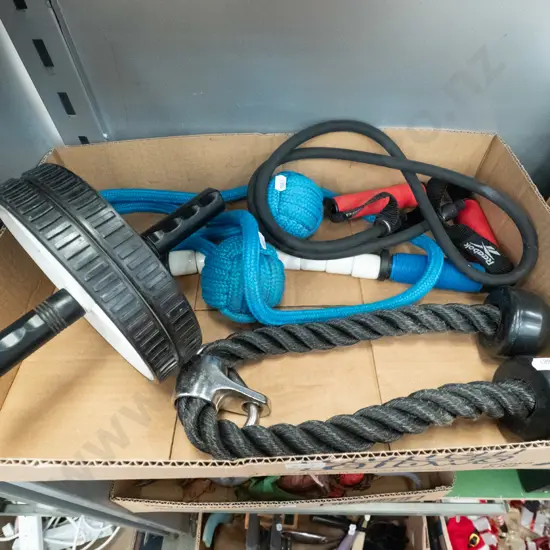 box of exercise equipment, skipping ropes, wheel etc