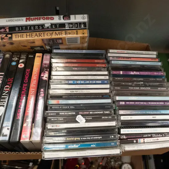 box of DVDs and CDs