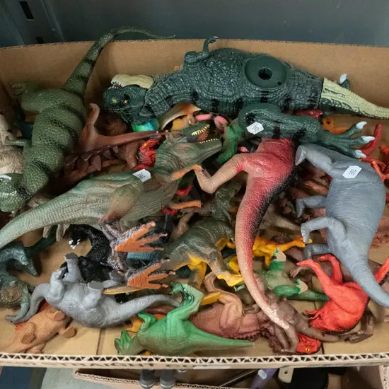box of model dinosuars
