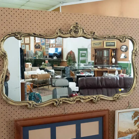 ornate gilt framed wall mirror