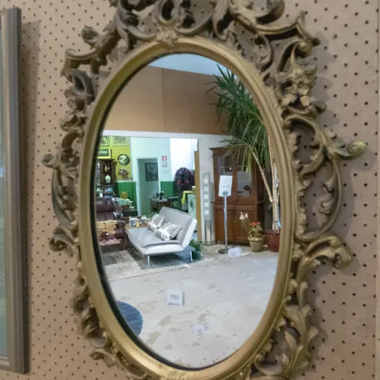 oval gilt framed wall mirror