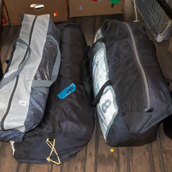 1x 8 person tent, 1x Navigator South tent - bag of poles for both