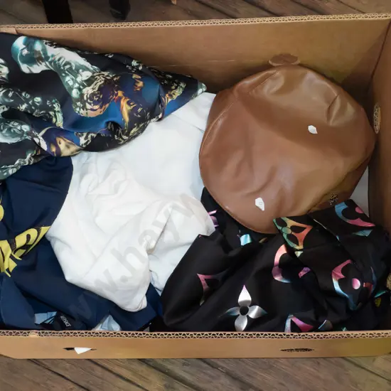 box; vinyl cap, various shirts, T-shirts etc