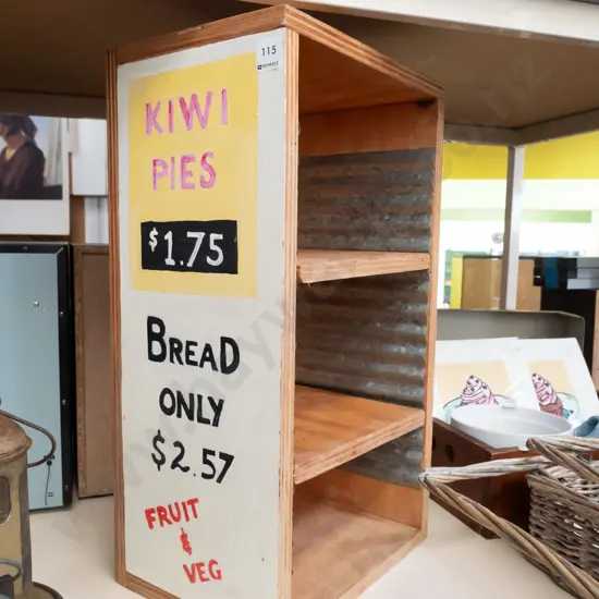 home made adjustable bookcase with hand painted advertising signs