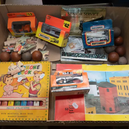 box; wooden balls, matchbox vehicles, xylophone etc