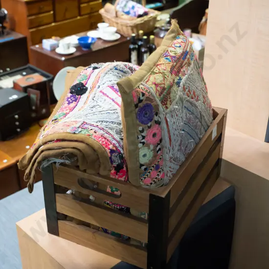 small wooden crate, ethnic cushions and covers