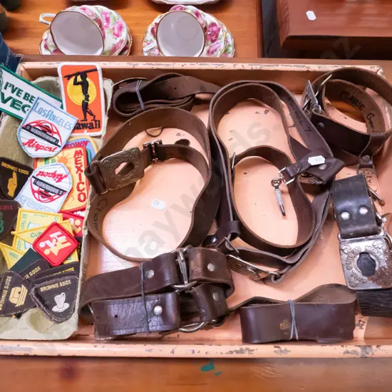 vintage wooden tray with girl guide belts and badges