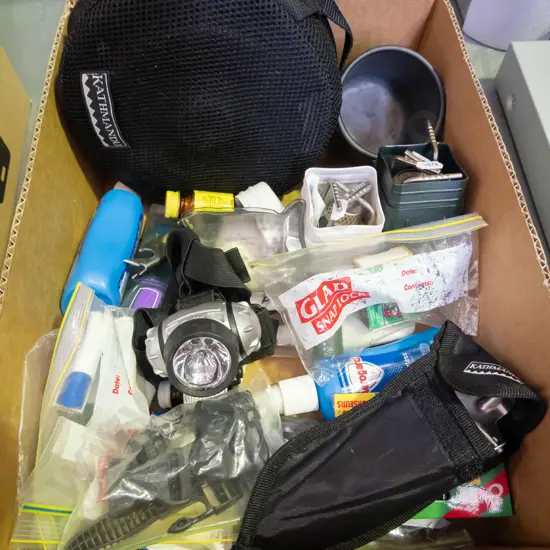 box; camping stoves, trowel, bug spray, pots etc