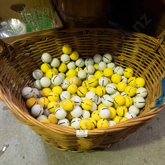 cane wood basket filled with driving range golf balls