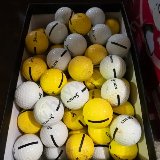 shoe box of driving range golf balls