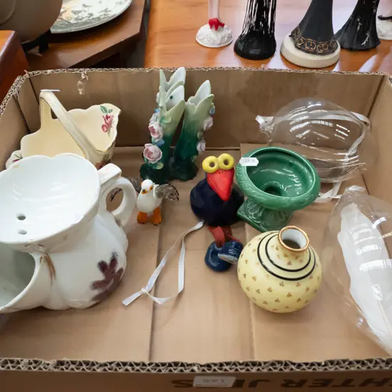 box; glass peacock feather ornaments, pukeko figurines, small vases etc