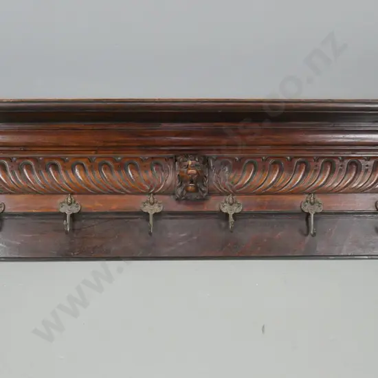 vintage oak wall mount coat rack with platform top, lion's head decoration, 6 brass hooks with figural embossed heads