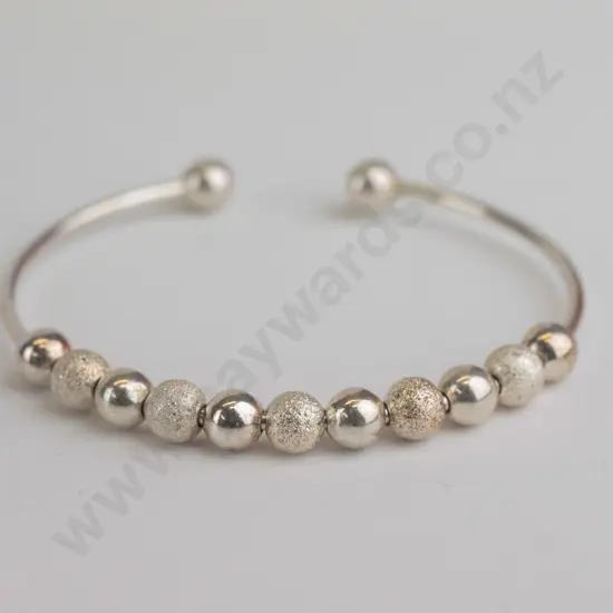 small silver bangle with silver beads stamped 925