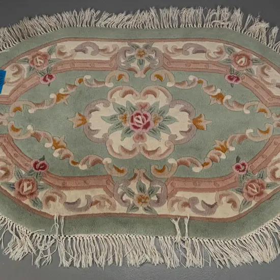 oval ended pastel shade woollen floor rug with fringed edge L-1550 W-910