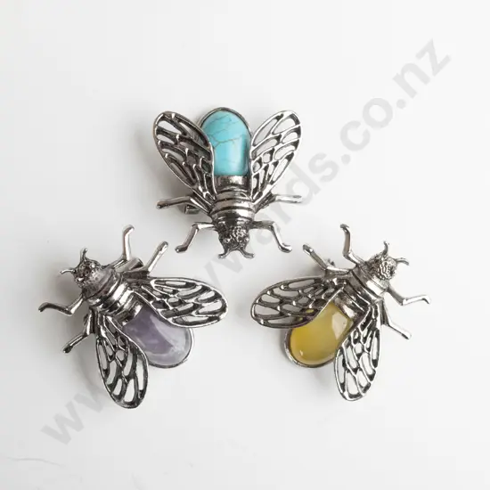 3 bug brooches each with a  different stone