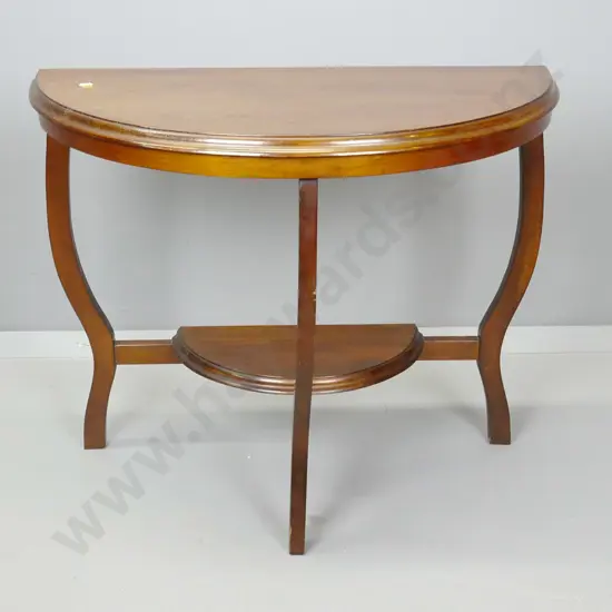 art deco mixed timber half-round occasional table w/3 shaped legs, bottom shelf. Some scratches to top H-610 W-750 D-370