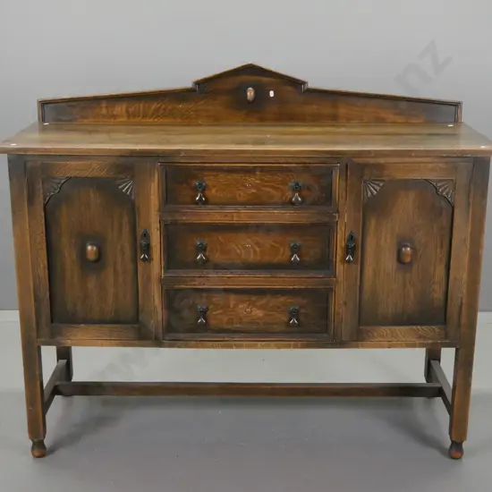 vintage oak Jacobean style sideboard with shaped upstand, 3 central drawer, 2 panelled doors w/fan-shaped corner